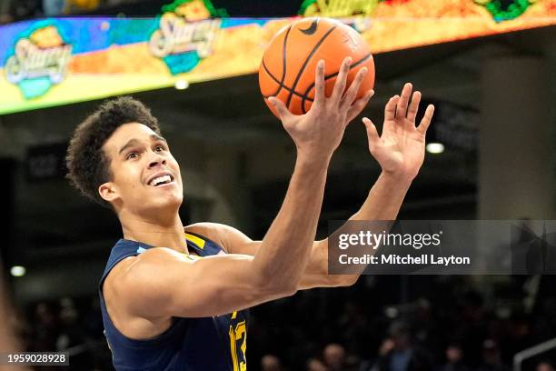 Oso Ighodaro of the Marquette Golden Eagles drives to the basket in the first half during a college basketball game against the DePaul Blue Demons at...