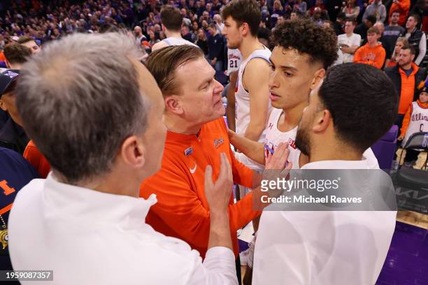 Head coach Brad Underwood of the Illinois Fighting Illini confronts Ty Berry and head coach head coach Chris Collins of the Northwestern Wildcats...
