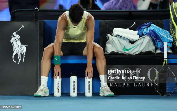 Carlos Alcaraz of Spain adjusts his bottles during their quarterfinals singles match against Alexander Zverev of Germany during the 2024 Australian...