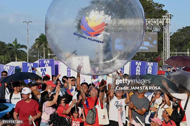 Supporters of Philippine President Ferdinand Marcos Jr attend the kick-off rally for the New Philippines movement at Quirino Grandstand in Manila on...