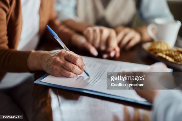 close up of signing a contract. - official document stock pictures, royalty-free photos & images