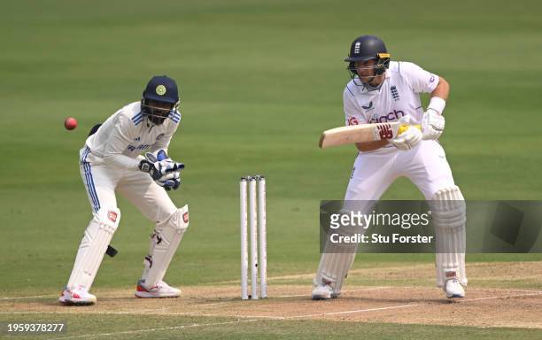Joe Root of England bats watched by India wicketkeeper Srikar Bharat during day one of the 1st Test Match between India and England at Rajiv Gandhi...