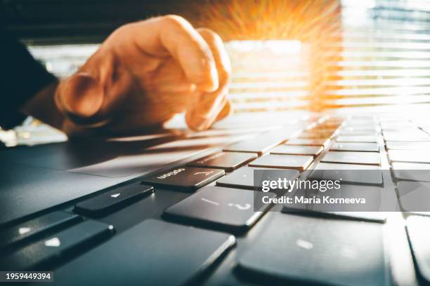 close up of hands using laptop. - enter key stock pictures, royalty-free photos & images