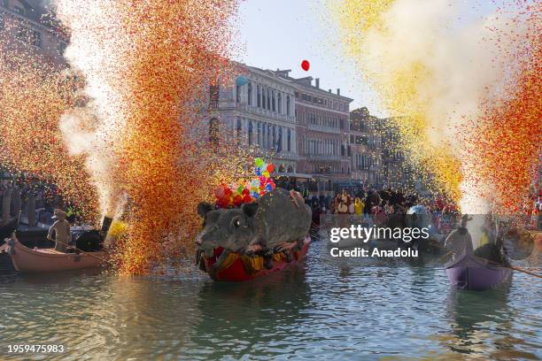 Boat carrying a large mouse made of paper-mache called 'Pantegana' passes during the carnival regatta in the Grand Canal of Venice, Italy on January...