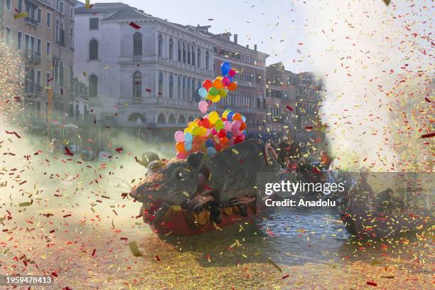 Boat carrying a large mouse made of paper-mache called 'Pantegana' passes during the carnival regatta in the Grand Canal of Venice, Italy on January...