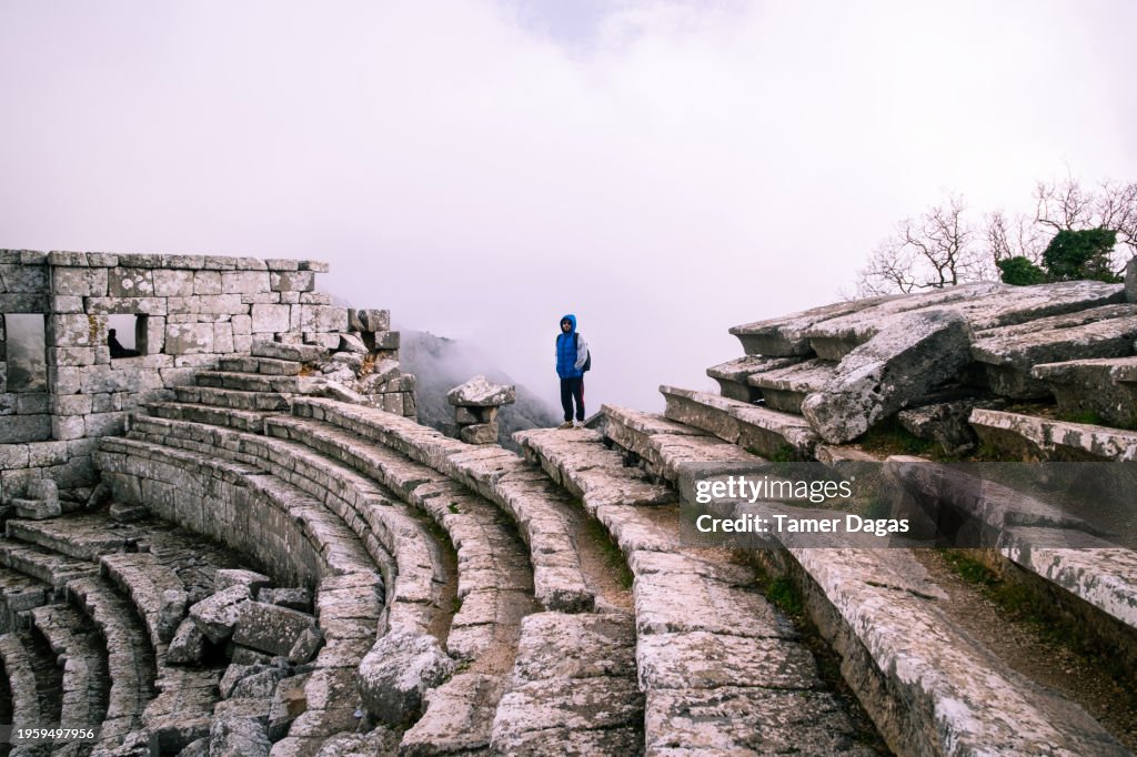 A man on the foggy peak