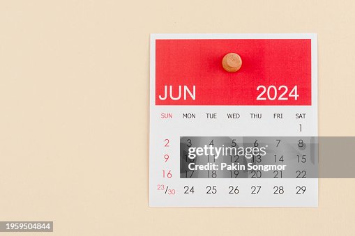 Desk Calendar 2024: June calendar is used to plan daily work and life with a push pin on a beige color paper background.