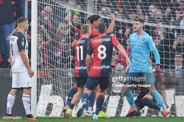 Josep Martinez of Genoa celebrates with his team-mates after saving a penalty kick taken by Nikola Krstovic of Lecce during the Serie A TIM match...