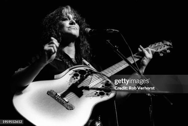 Melanie performs on stage at Folk Festival, de Doelen, Rotterdam, Netherlands, 4th September 1982. She is playing an Ovation acoustic guitar.