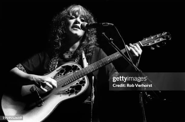 Melanie performs on stage at Folk Festival, de Doelen, Rotterdam, Netherlands, 4th September 1982. She is playing an Ovation acoustic guitar.