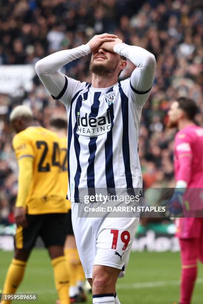 West Bromwich Albion's English midfielder John Swift reacts to a missed chance during the English FA Cup fourth round football match between West...
