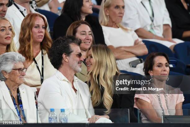 Doyle Bramhall and Elle Macpherson kiss at Rod Laver Arena during the Semi Final singles match between Coco Gauff of the United States and Aryna...