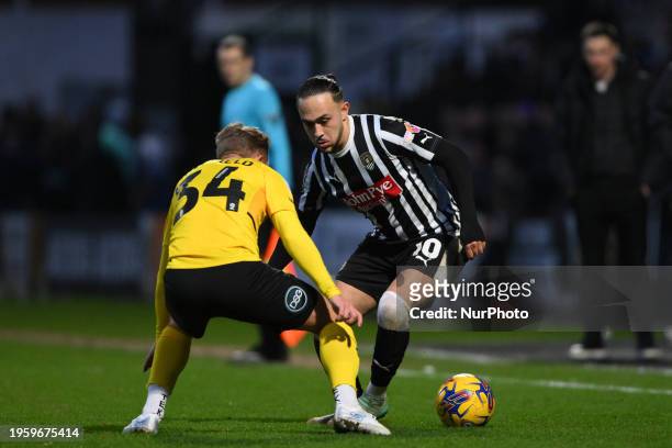 Jodi Jones of Notts County is under pressure from Ben Whitfield of Barrow during the Sky Bet League 2 match between Notts County and Barrow at Meadow...