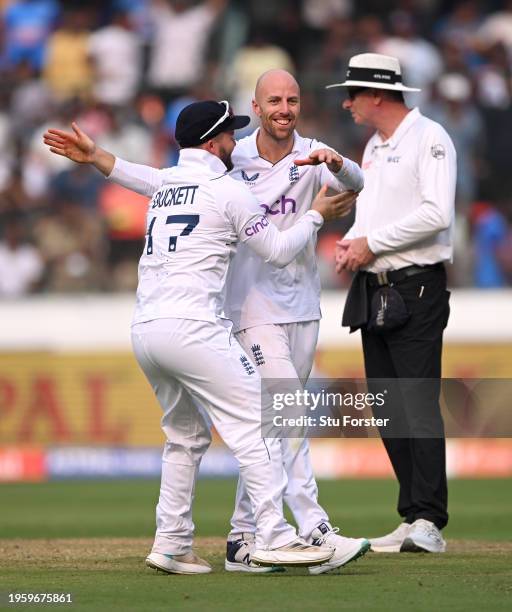 Jack Leach of England celebrates with Ben Duckett after dismissing India captain Rohit Sharma during day one of the 1st Test Match between India and...