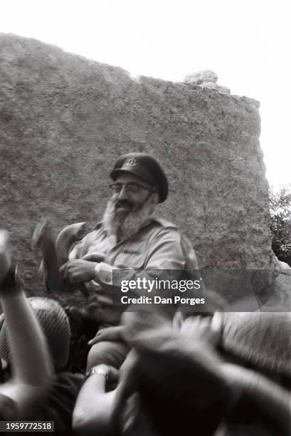 Holding a shofar , Polish-born Israeli rabbi and Chief of the Israel Defense Forces' Military Rabbinate Shlomo Goren is carried, by IDF soldiers,...