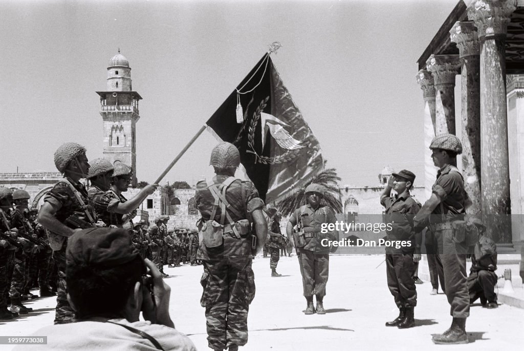 Israeli Soldiers Raise A Flag Outside The Dome Of The Rock