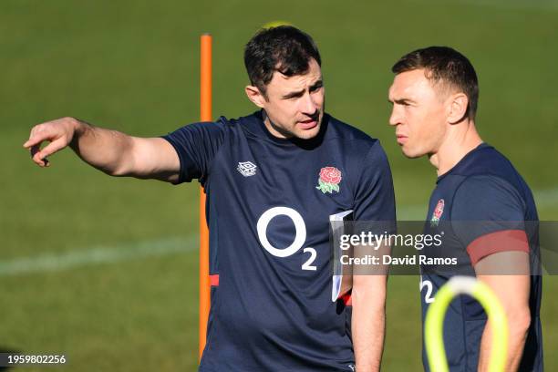 Felix Jones, Coach of England, talks with Kevin Sinfield, Defence Coach of England, during a training session at Camiral Golf & Wellness on January...