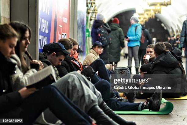 People take shelter at the Kontraktova Ploshcha subway station during Russian missile attack on January 23, 2024 in Kyiv, Ukraine. Russian strategic...