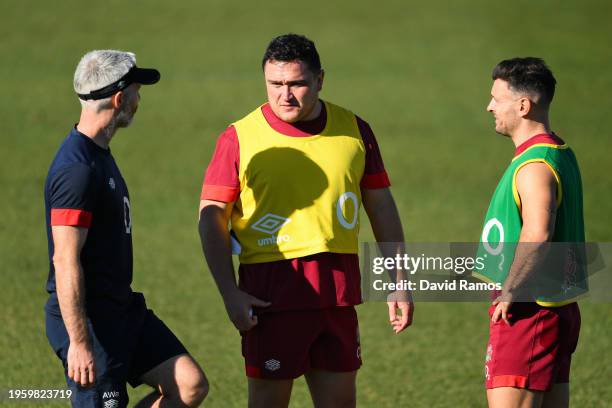 Jamie George, Captain of England, talks to Danny Care of England and Aled Walters, Head of Strength and Conditioning of England, during a training...