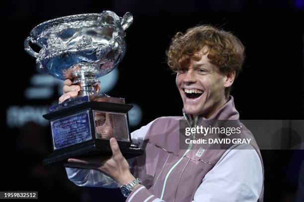 Italy's Jannik Sinner celebrates with the Norman Brookes Challenge Cup trophy after defeating Russia's Daniil Medvedev in the men's singles final...