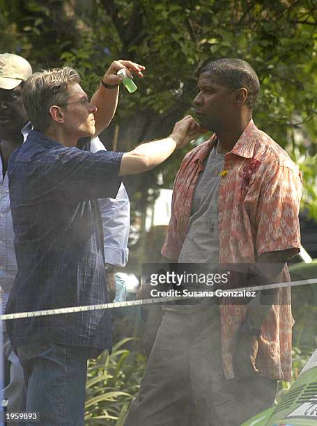 Actor Denzel Washington has makeup applied to his face prior to filming a scene from the film, "Man On Fire" while on location at Condesa Park April...