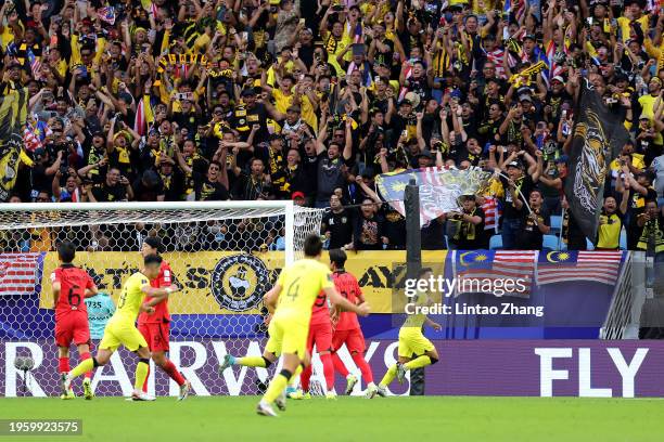 Arif Aiman Hanapi of Malaysia celebrates scoring his team's second goal during the AFC Asian Cup Group E match between South Korea and Malaysia at Al...