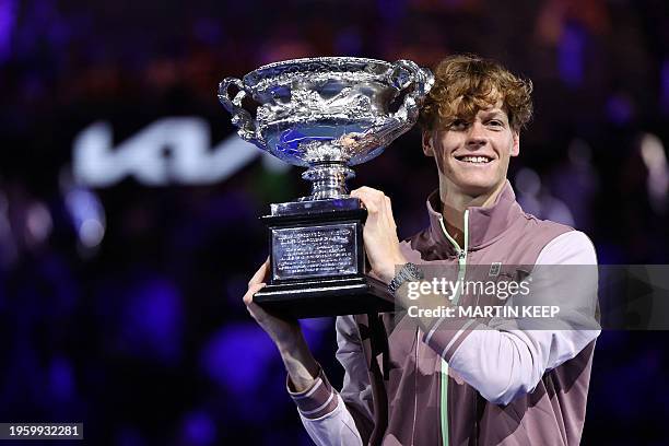 Italy's Jannik Sinner celebrates with the Norman Brookes Challenge Cup trophy after defeating Russia's Daniil Medvedev in the men's singles final...
