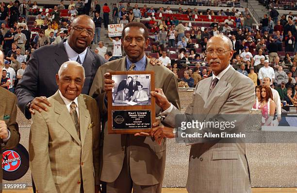Legends Bob Lanier, Will Robinson, Earl Lloyd and Dave Bing pose for a picture during half time of the game between the Detroit Pistons and the...