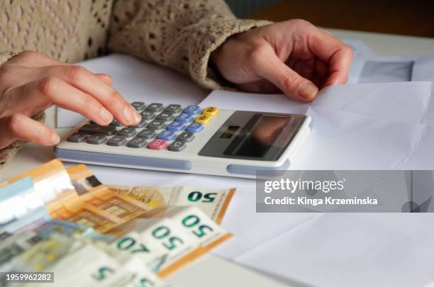 paying bills - bonus pay stock pictures, royalty-free photos & images