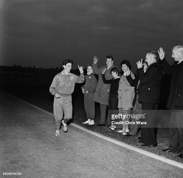 English sprinter Dorothy Hyman greeting fans at her home track near Doncaster, September 1962. Hyman returned to training after competing in the...