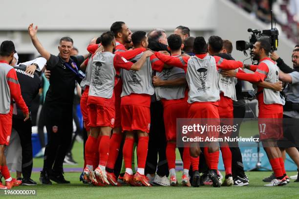 Players of Bahrain celebrate after the AFC Asian Cup Group E match between Jordan and Bahrain at Khalifa International Stadium on January 25, 2024 in...