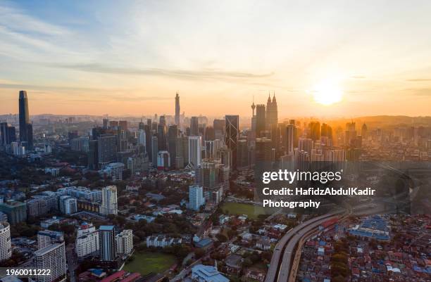 high angle kuala lumpur aerial skyline with busy streets and expressway - malaysia city stock pictures, royalty-free photos & images