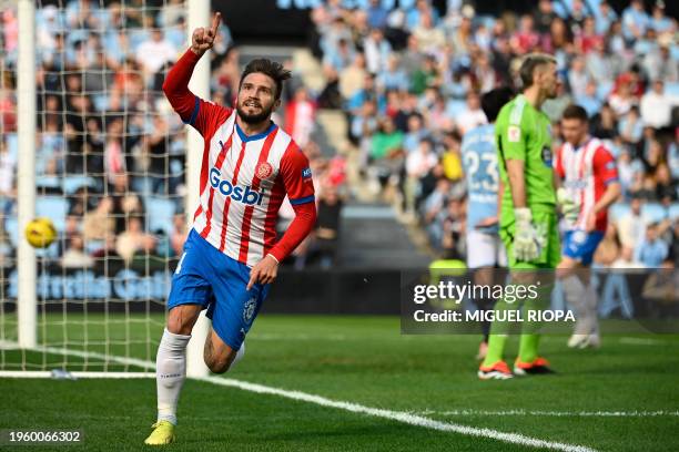 Girona's Spanish forward Cristian Portugues celebrates after scoring his team's first goal during the Spanish league football match between RC Celta...