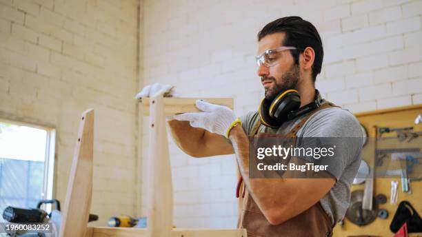 carpenter in workshop. - sand paper stock pictures, royalty-free photos & images