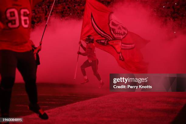 Ross Cockrell of the Tampa Bay Buccaneers runs on the field with a flag against the New Orleans Saints prior to the game at Raymond James Stadium on...