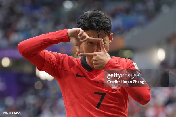 Son Heung-min of South Korea celebrates scoring his team's third goal during the AFC Asian Cup Group E match between South Korea and Malaysia at Al...