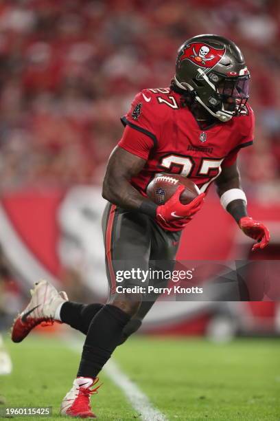 Ronald Jones of the Tampa Bay Buccaneers runs upfield against the New Orleans Saints during a game at Raymond James Stadium on December 19, 2021 in...