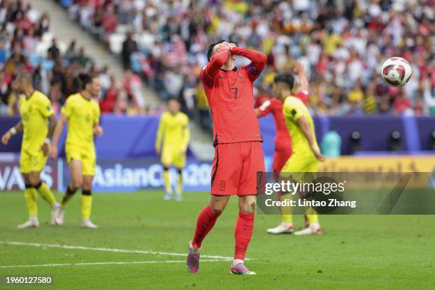 Son Heung-min of South Korea reacts after a missed chance during the AFC Asian Cup Group E match between South Korea and Malaysia at Al Janoub...