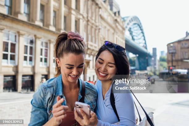 i love this photo of us! - two people on phone stock pictures, royalty-free photos & images