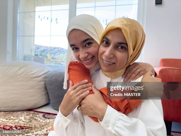 muslim mother and daughter - balkans stock pictures, royalty-free photos & images