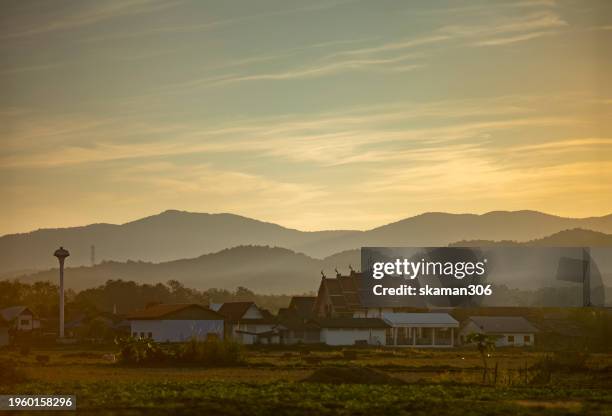 scenic beauty of sunset over mountains and agricultural fields: capturing the essence of golden hour in rural landscape - 岩手山 ストックフォトと画像