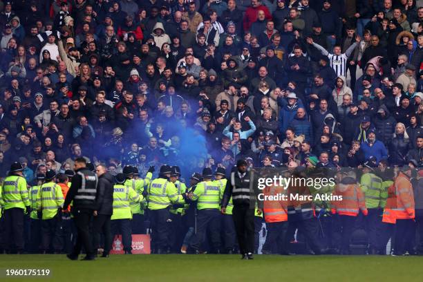 Police and stewards react as trouble breaks out during the Emirates FA Cup Fourth Round match between West Bromwich Albion and Wolverhampton...
