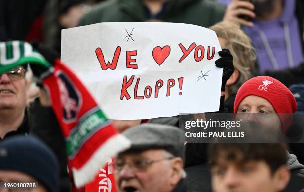 Fan holds a tribute to Liverpool's German manager Jurgen Klopp ahead of the English FA Cup fourth round football match between Liverpool and Norwich...