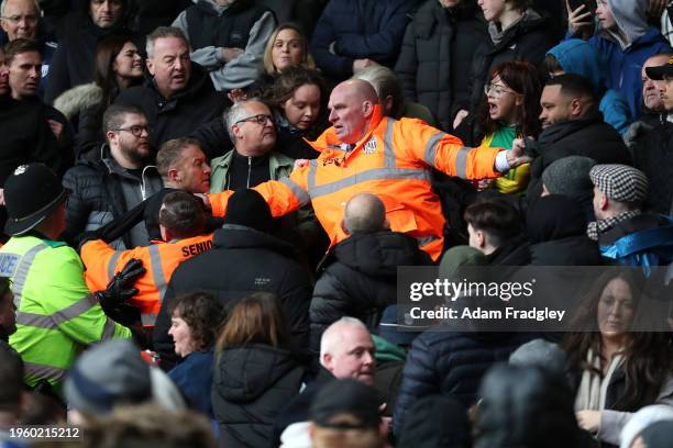 Trouble erupts in the stadium as a Wolverhampton Wanderers fan celebrates their second goal amongst Albion fans, forcing a 36 minute game stoppage...