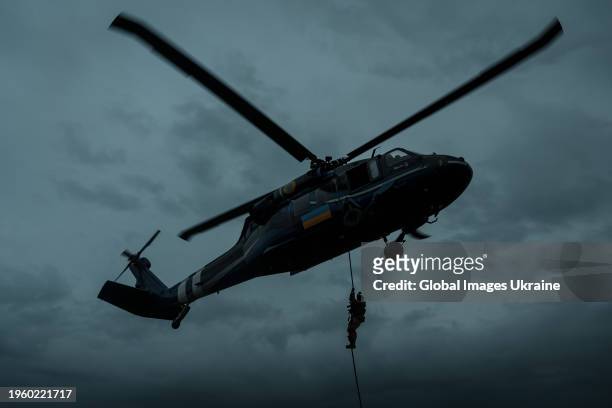 Soldier of Shaman battalion landing from UH-60 Black Hawk helicopter during training on April 1, 2023 in UNSPECIFIED, Ukraine. Shaman battalion is...