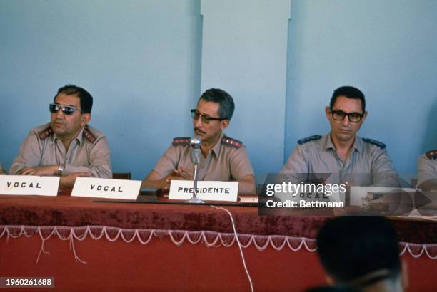 The three-man military tribunal listening to the prosecution's closing argument during the trial of French journalist Regis Debray in Camiri,...