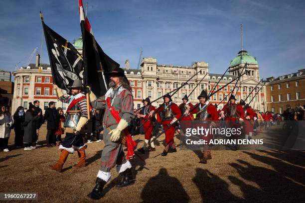 An officer leads his musketeers from the Marquis of WInchester Regiment part of the King's Army of the English Civil War Society as they march across...