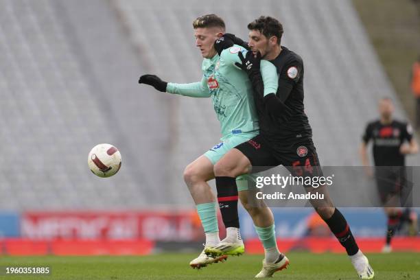 Salih Dursun of VavaCars Fatih Karagumruk competes with Adolfo Gaich of Caykur Rizespor during the Turkish Super Lig 23rd week match between Caykur...