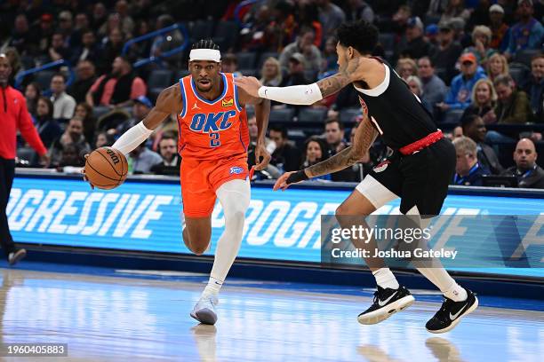 Shai Gilgeous-Alexander of the Oklahoma City Thunder handles the ball during the first half against the Portland Trail Blazers at Paycom Center on...