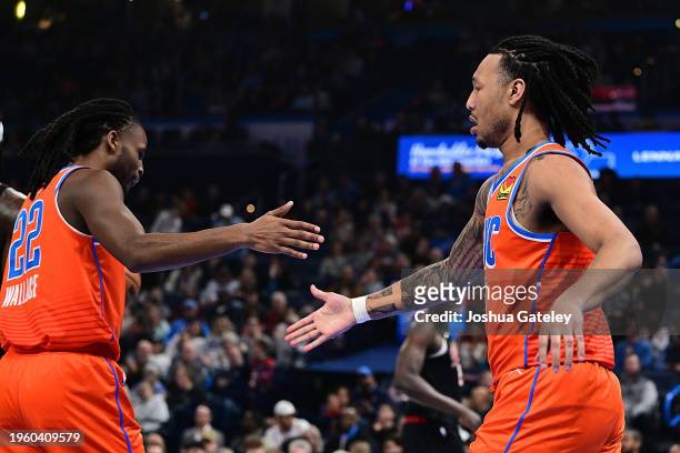 Jaylin Williams and Cason Wallace of the Oklahoma City Thunder celebrate during the first half against the Portland Trail Blazers at Paycom Center on...